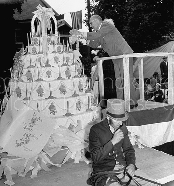 Charles F. Kettering (Top) preparing to cut the cake for celebration of his birthday in his home town.