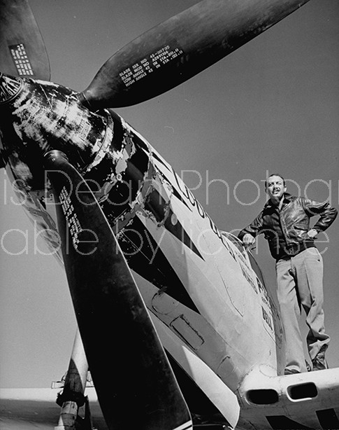 Pilot Alvin "Tex" Johnston standing on wing of his plane.