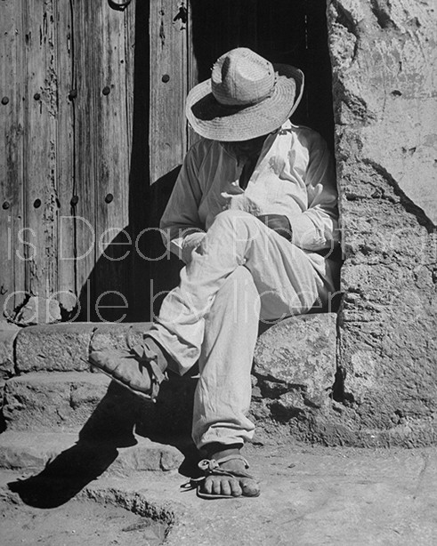 A man taking a siesta in a doorway at the Toluca Market.