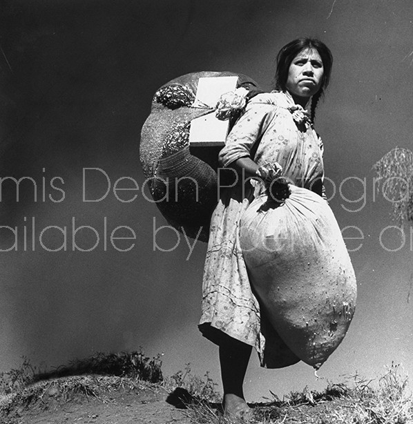 A woman carrying bundles to market.