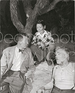 Actor Walter Huston (R) bearded and disheveled, in character from film "Treasure of Sierra Madre, " with dirctor son John Huston and step grandson Pablo Huston on set of film.