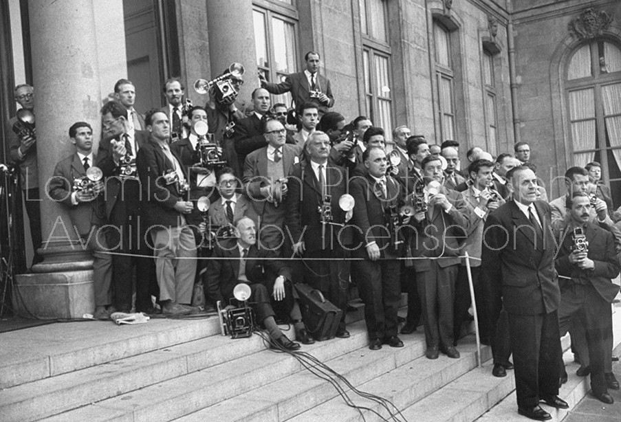 Press photographers waiting for members of the cabinet to arrive at Elysee Palace in Paris, France.