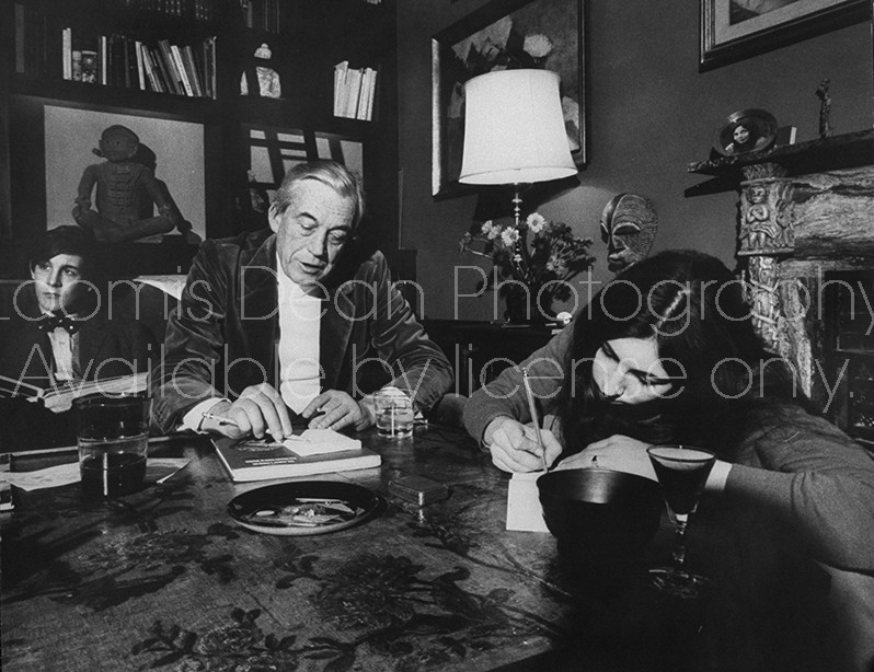 Actor/Director John Huston (C) sitting in the comfortable family room area of his home with his son and daughter.