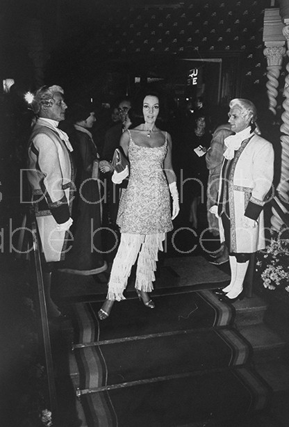 A woman entering the Lido in Paris.