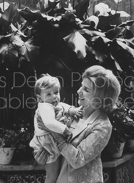 Duchess of Alba holding her youngest son, at her Seville palace.