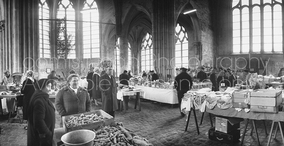 Public French market in Gothic Saint Pierre Church.