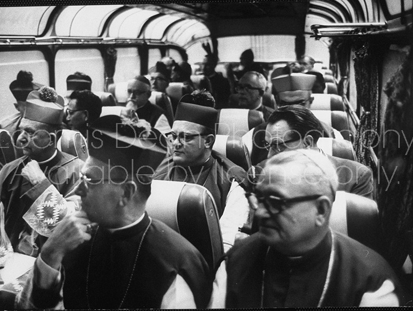 Bishops traveling by bus during visit to Rome for Ecumenical Council.