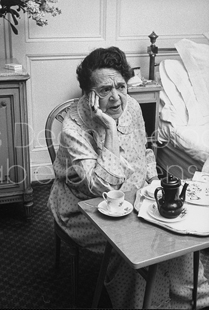 Author and columnist Elsa Maxwell breakfasting in a Ritz hotel room.