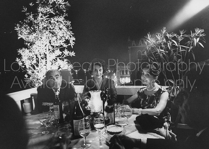 Collector Arnold Maremont (L) and wife (R), dining with Mrs. Maremont (R).