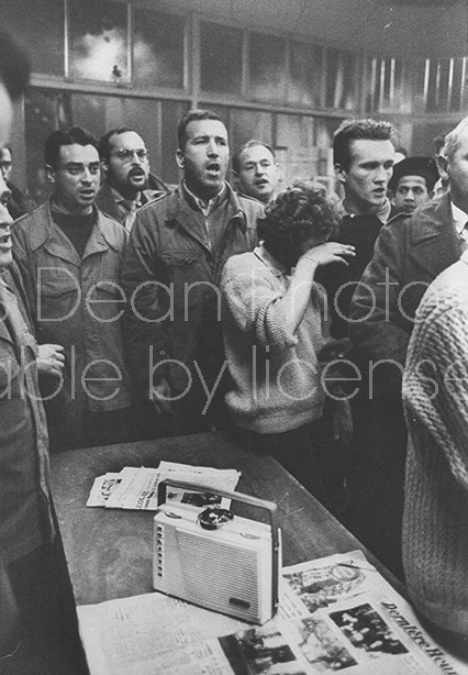 Defiant Algerian insurrectioniest begin singing the "Marseillaise" while listening to portable radio broadcast at Rebel Colonists HQ of Gen. De Gaulle's announced withdrawal of French forces fr. the country & his recognition of Algerian Independence.