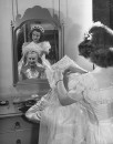 Bride dressing for wedding ceremony at West Point.