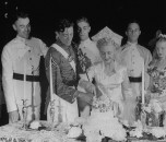 Bride and groom cutting cake at wedding reception at West Point.