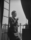 NY Post Financial Columnist Sylvia Porter, standing on the terrace of her apt.