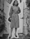 Debutante Debbie Love wearing a dress and heels.
