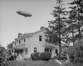 Blimp flying over home of Charles F. Kettering, at his home town celebration of his birthday.