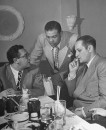 Boxer Joe Louis with patrons at his restaurant.