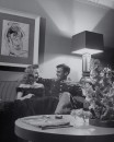 Couple sitting on sofa.