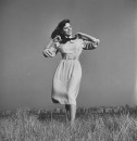 Model wearing dress designed by Jonathan Logan.