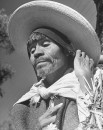A man wearing a large straw hat at the Toluca Market.