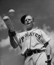 Team clown William Wietelman bouncing ball on bat to strengthen wrists.