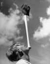 Team clown William Wietelman balancing bat on chin.