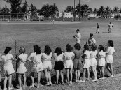 Girls from Miami Beach High School gym class watching Pirates work out.
