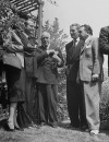(L to R)Actors Red skeleton and his wife, Jimmy McHugh, Errol Flynn and Edward G. Robinson attending John Decker's funeral.
