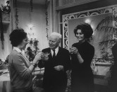 Actor/Director Charlie Chaplin (C) standing between wife Oona and Sophia Loren celebrating 77th birthday on the set of his film "A Countess from Hong Kong."