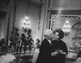 Actor/Director Charlie Chaplin (L) kissing Sophia Loren on the cheek while celebrating 77th birthday party on the set of his film "A Countess from Hong Kong."