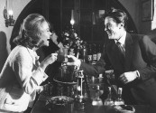 Actor Alain Delon (R) having a drink with actress Jane Fonda.