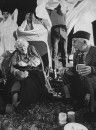 Actress Margaret Rutherford and husband Stringer Davis telling ghost stories to youth around a campfire.