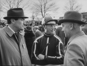 Actor Gregory Peck (L) talking with jockey Pat Taaffe (C),  before Grand National race.