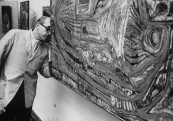 Arnold Maremont, looking at artist Friedrich Hundertwasser's, painting "L' Oeuf De L" Anlien Japon Precolombien".
