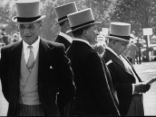 Britain's "Old Etonians" in distinctive top hats, attending the races.