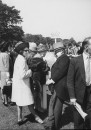 Daughter of conservative party chairman Iain Macleod,Diana Macleod (White Coat), and Lord and Lady Crathorne (2nd R), attending the Derby at Epson Downs.