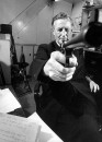 British mystery writer Ian Fleming pointing gun