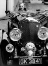 British mystery writer Ian Fleming gunning the motor in a friend's 4.5 litre Bentley.