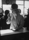 British fashion model Sandra Douglas-Home (C) sipping coffee in airport before New York trip.