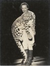 RINGLING CIRCUS TRAINER HOLDING LEOPARD 