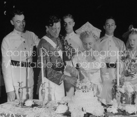 Bride and groom cutting cake at wedding reception at West Point.