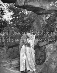 Cadet kissing his bride following West Point wedding.