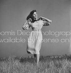 Model wearing dress designed by Jonathan Logan.