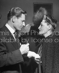 Nelson A. Rockefeller (L) attending US Ambassador's reception on eve of Miguel Aleman's inagural.