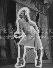 A dancer from the play "Beggar's Holiday" modeling one of the costumes.