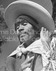 A man wearing a large straw hat at the Toluca Market.