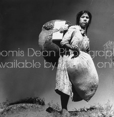 A woman carrying bundles to market.