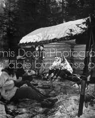 Co-eds wearing warm clothing at a mountain cabin.