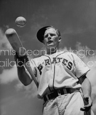 Team clown William Wietelman bouncing ball on bat to strengthen wrists.