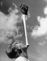 Team clown William Wietelman balancing bat on chin.