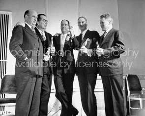Pres. Pepsi Cola Co. Walter S. Mack Jr. (C) standing with other members of the firm.